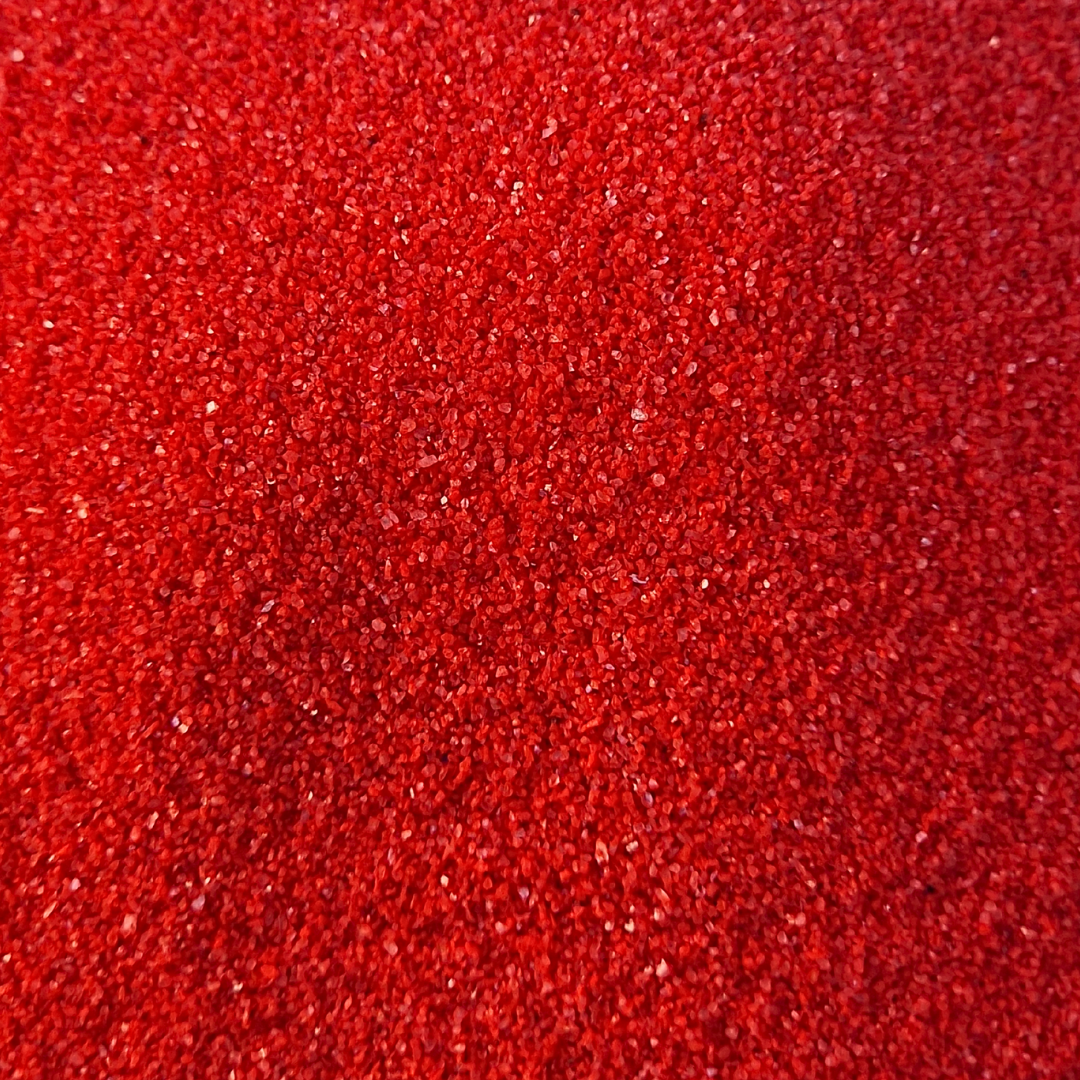 Arena de color rojo fuerte